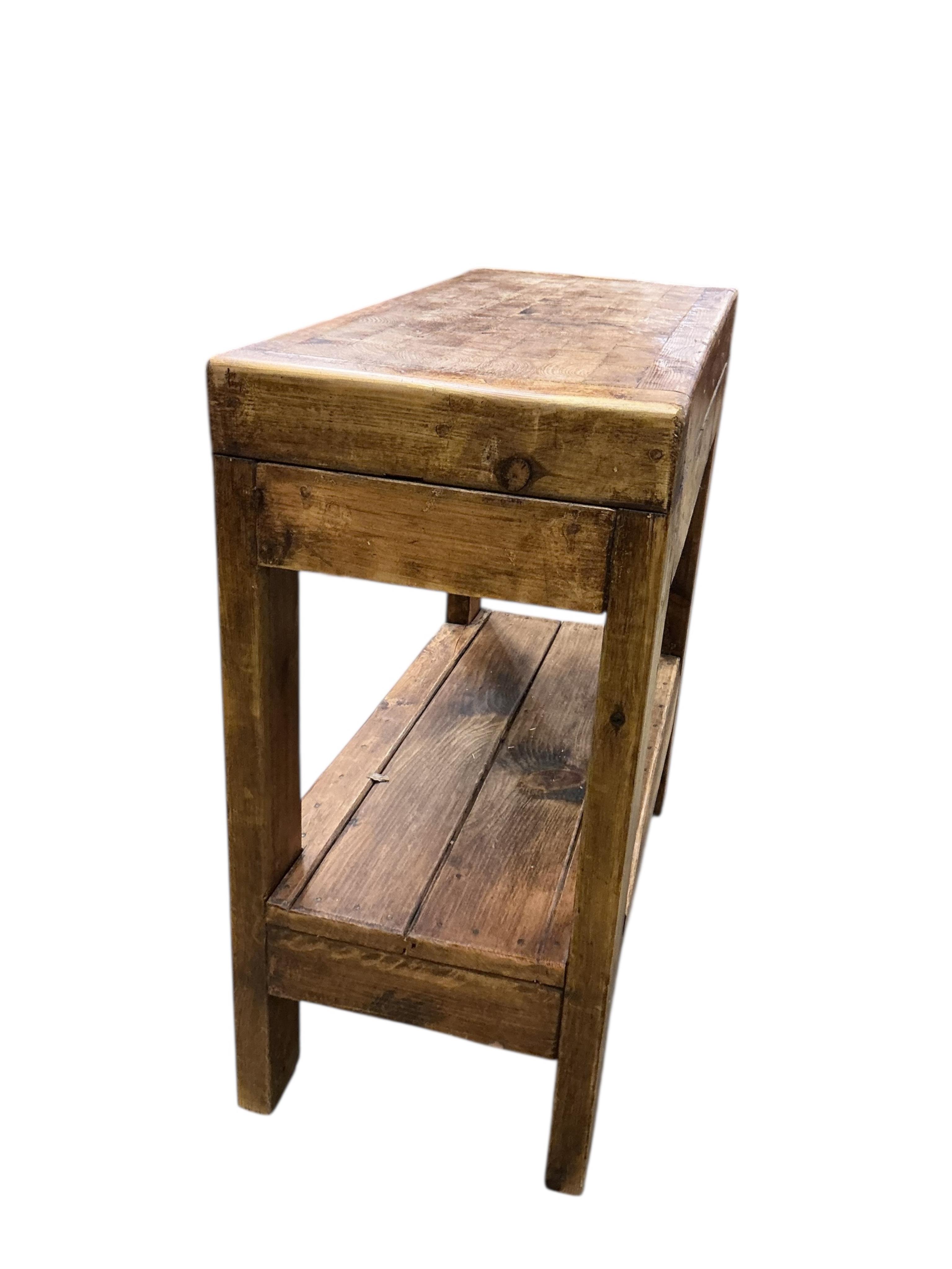 A rectangular pine two tier butcher's block, width 85cm, depth 40cm, height 85cm
